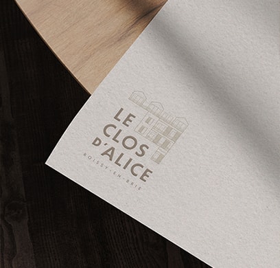 Stylized blue and pink image of a whiskey glass with the wordmark of Vèloce in pink all-caps letters above.